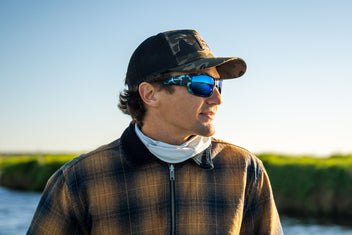 Close-up of sunglasses worn outdoors in natural light